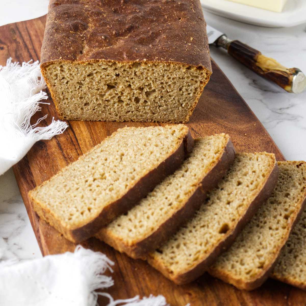 Whole wheat einkorn bread on a cutting board.