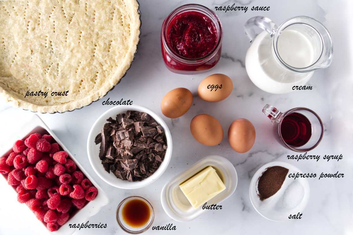 Raspberry tart, cream, raspberry syrup, espresso powder, salt, butter, eggs, chocolate, vanilla, and raspberries.