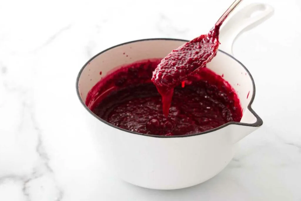 Thick raspberry sauce with seeds.