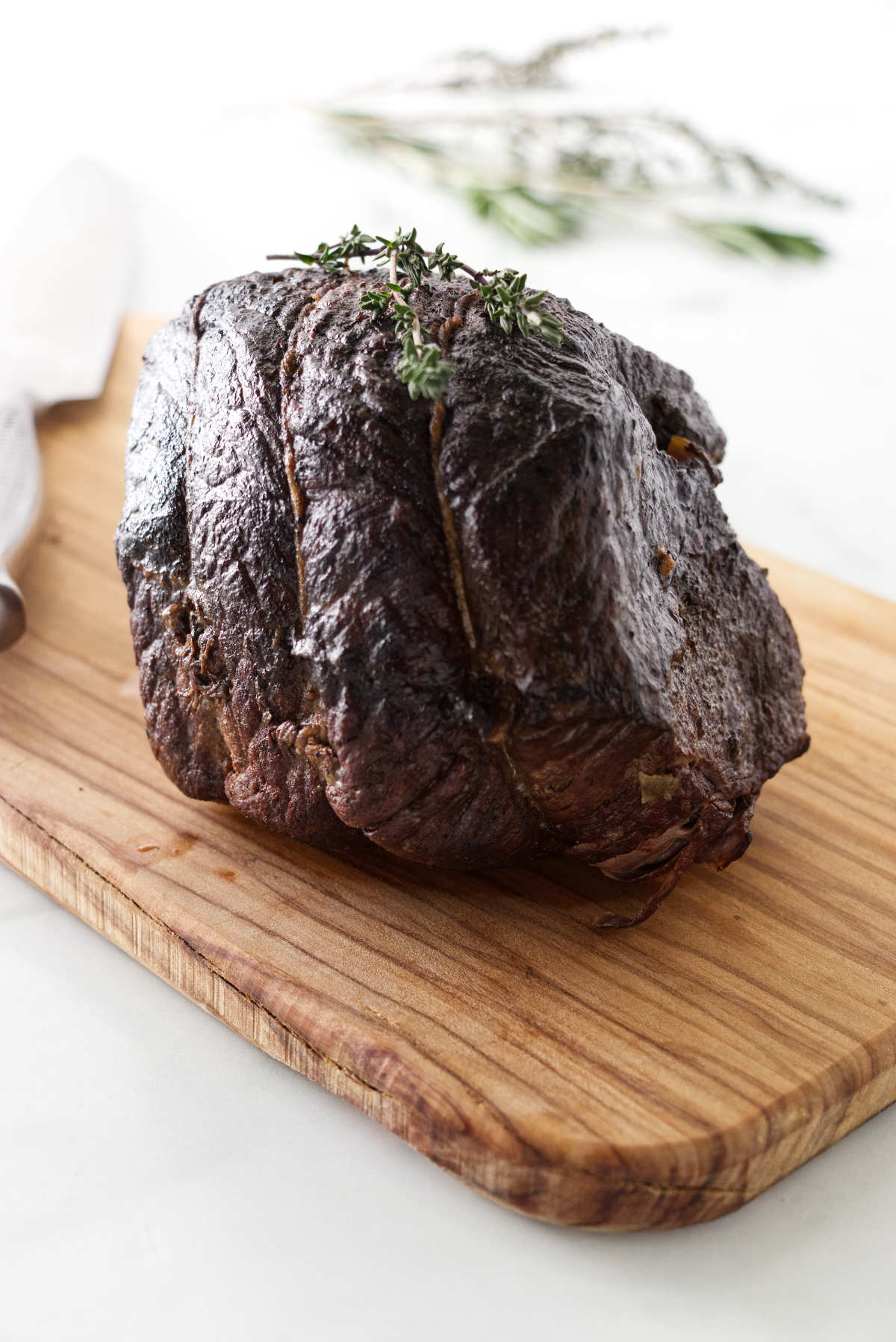 A sirloin roast on a cutting board.