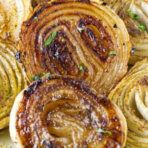 Golden brown slices of onions after being smoked on a pellet grill.
