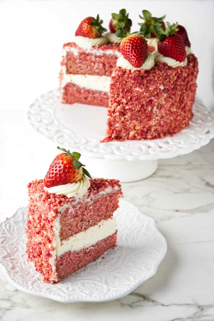 A strawberry cake with strawberry crumble coating the outside.
