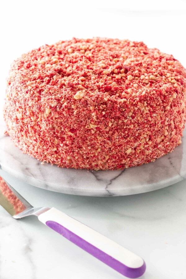 Strawberry crunch crumbles covering a cake.