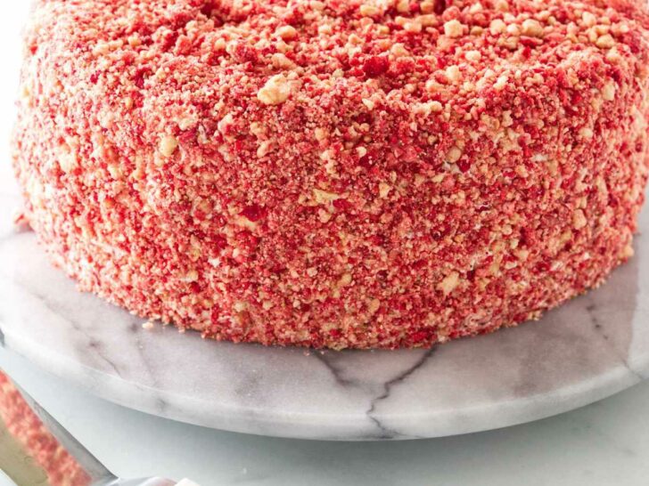Strawberry crunch crumbles covering a cake.