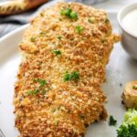 Panko chicken on a plate with veggies.