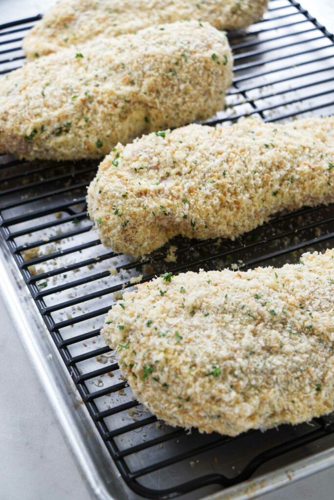 Panko crusted chicken on a baking sheet.