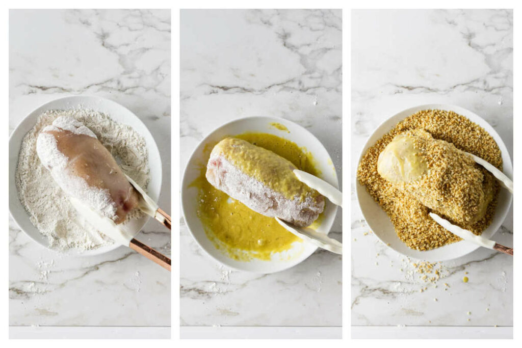 Dipping a stuffed chicken breast in flour then egg wash, then panko bread crumbs.