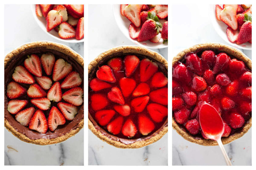Layering fresh strawberries and jello in a graham cracker crust that has a layer of chocolate ganache.
