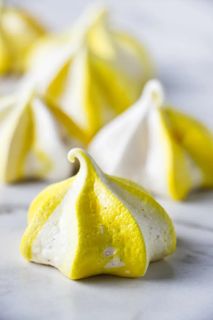 A lemon meringue kiss on a marble counter.