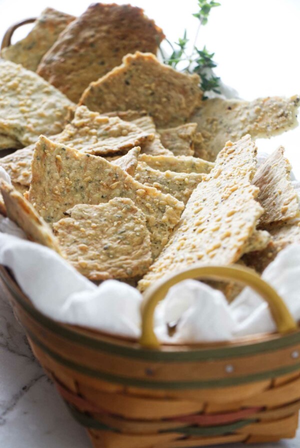 A basket filled with homemade sourdough starter crackers.