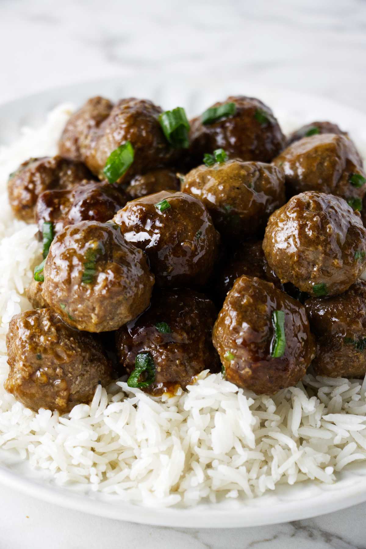 Meatballs on a bed of white rice.