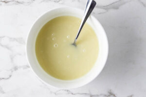 White chocolate ganache in a small bowl.