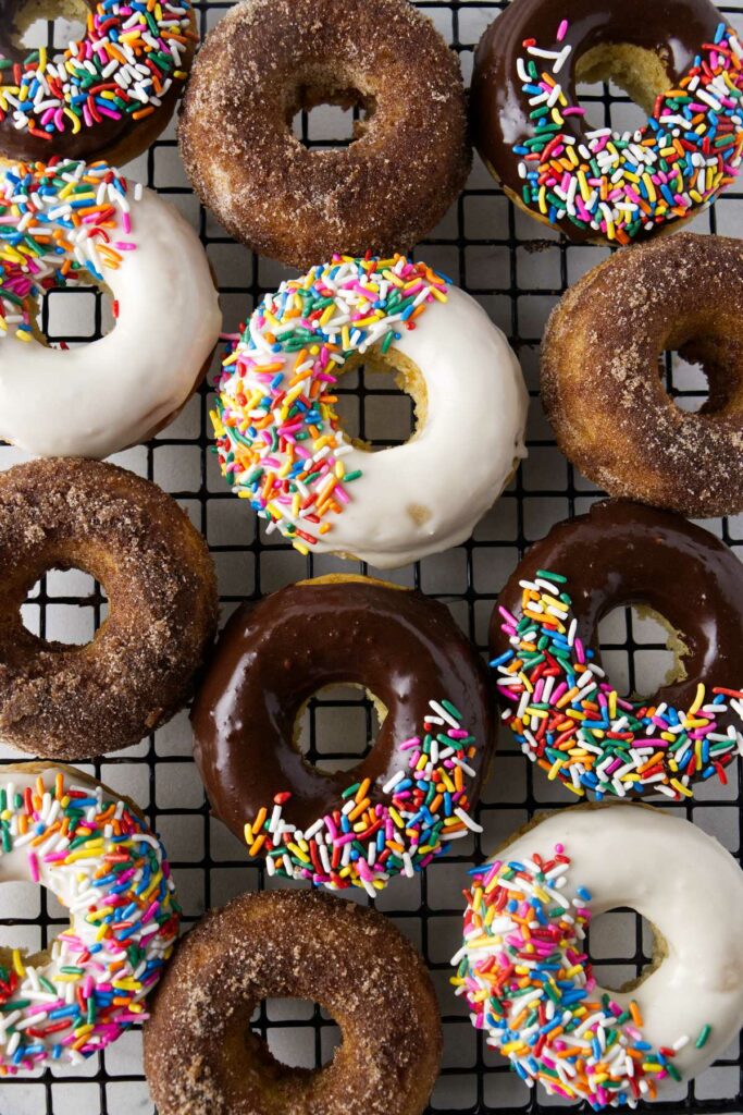 Baked sourdough donuts with vanilla glaze, chocolate glaze, and cinnamon sugar toppings.