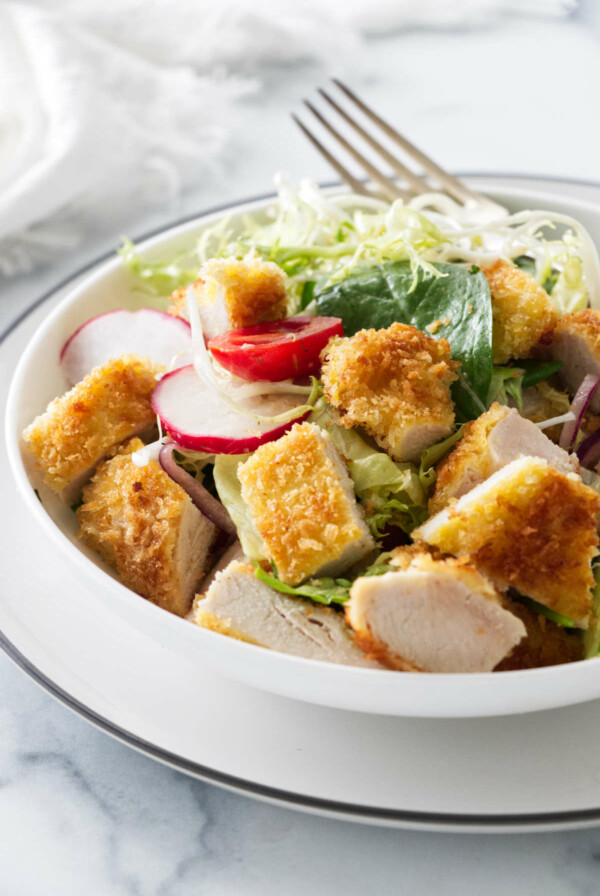 Plated serving of crispy chicken salad.