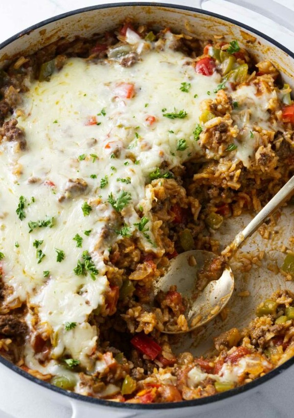 A skillet casserole with ground beef, bell peppers, and rice.