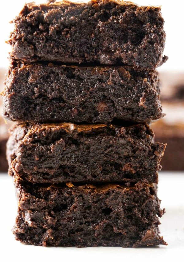 Four slices of sourdough brownies stacked on top of each other.