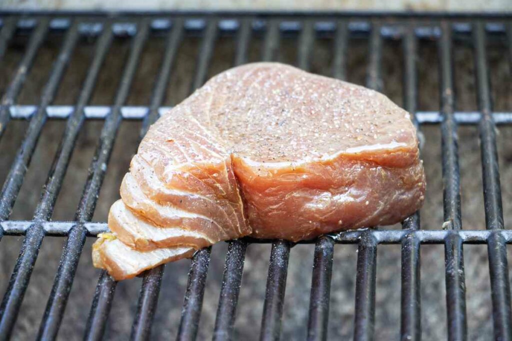 A tuna steak on a grill.