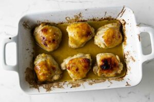 Baked chicken thighs with a honey herb glaze.