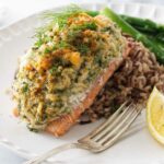 Plated crab and shrimp stuffed salmon.