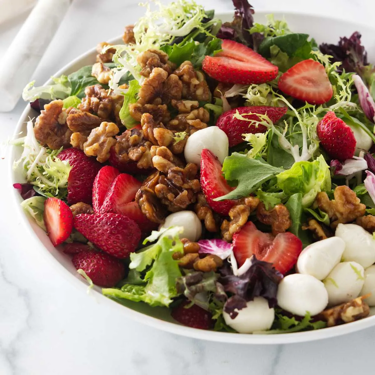 Close up view of the strawberry walnut salad.