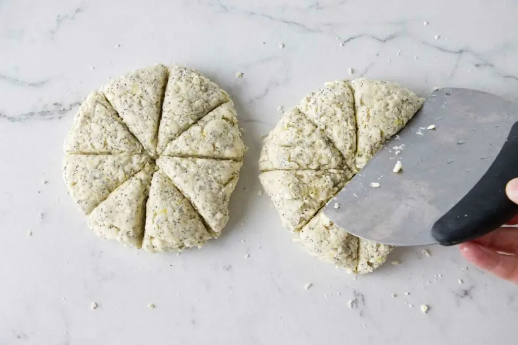 Cutting scone dough into individual scones.