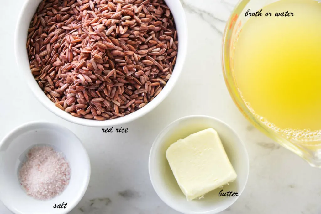 Ingredients: red rice, chicken broth, butter, and salt. Recipe for Instant Pot Whole Grain Red RIce
