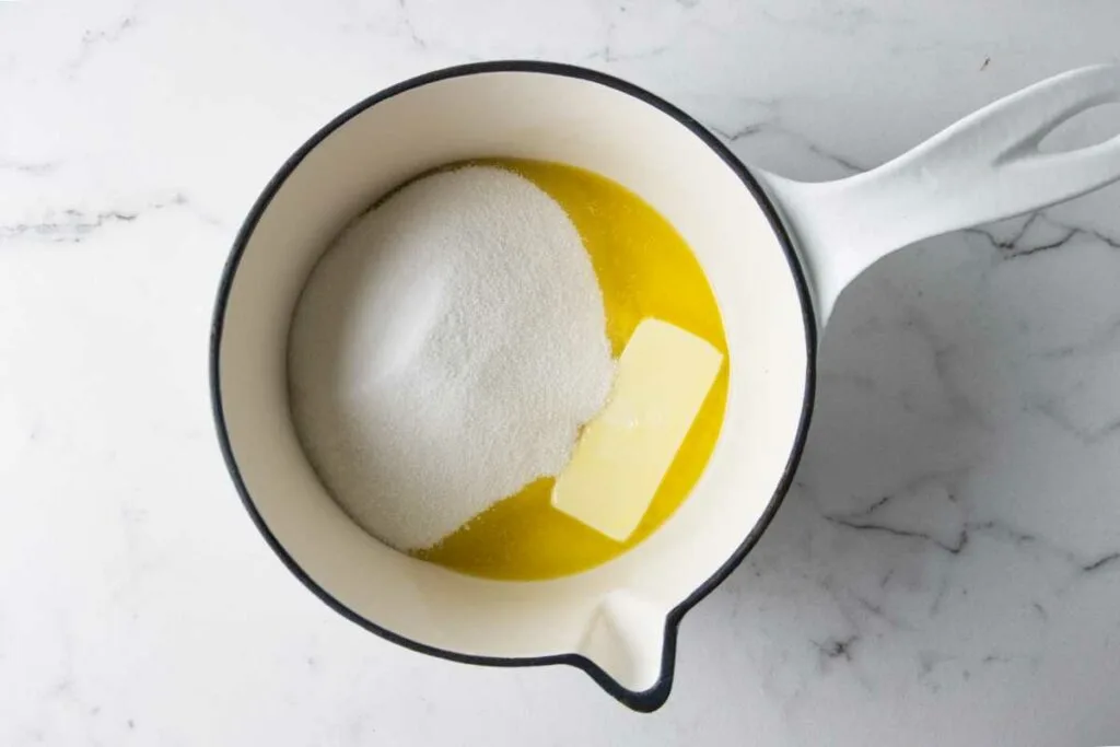 Melting the butter with sugar in a saucepan.