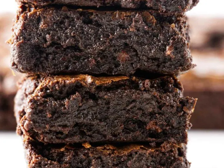 Four slices of sourdough brownies stacked on top of each other.