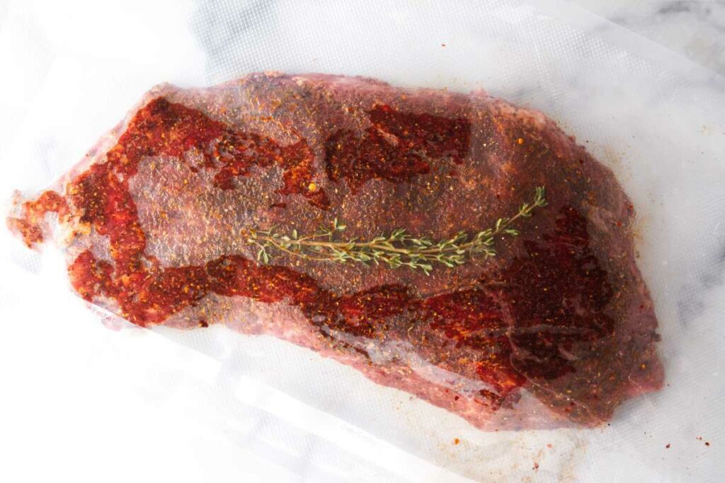 Prepared flat iron steak in a sous vide bag.