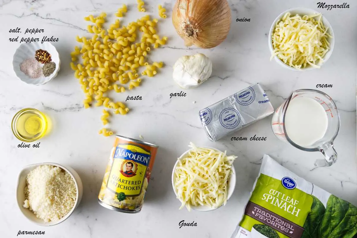 Ingredients for spinach artichoke pasta bake.