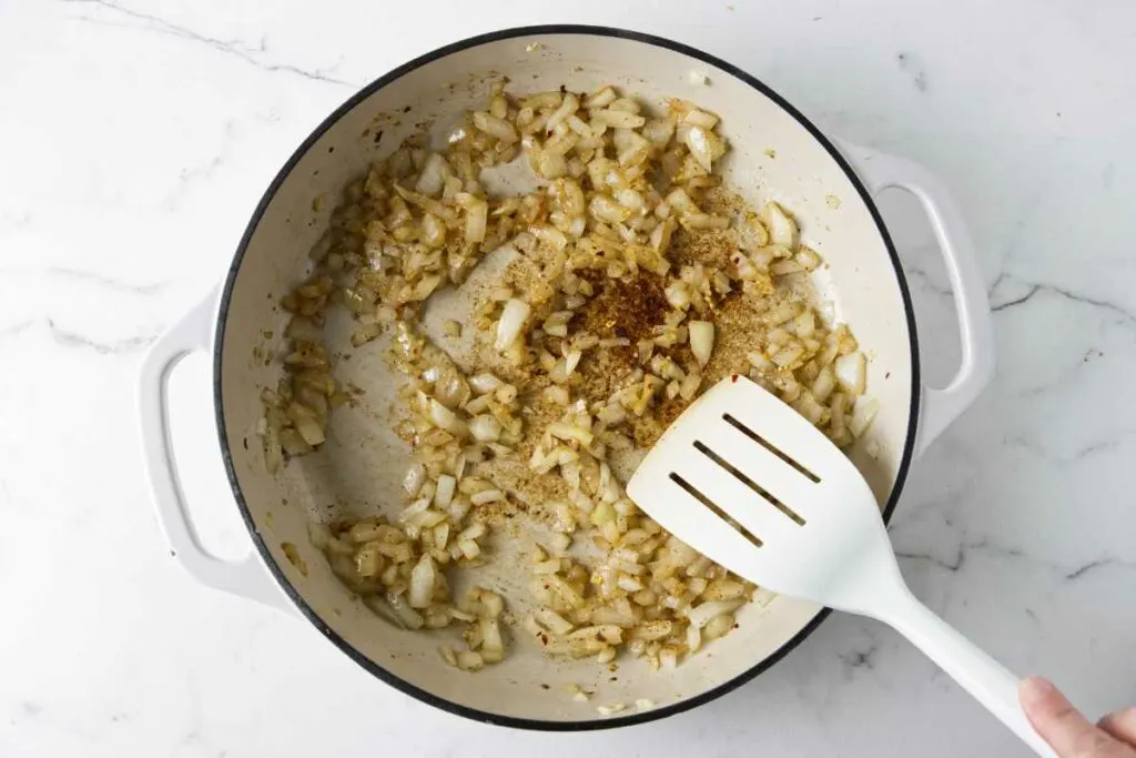 Cooking onions in a skillet.