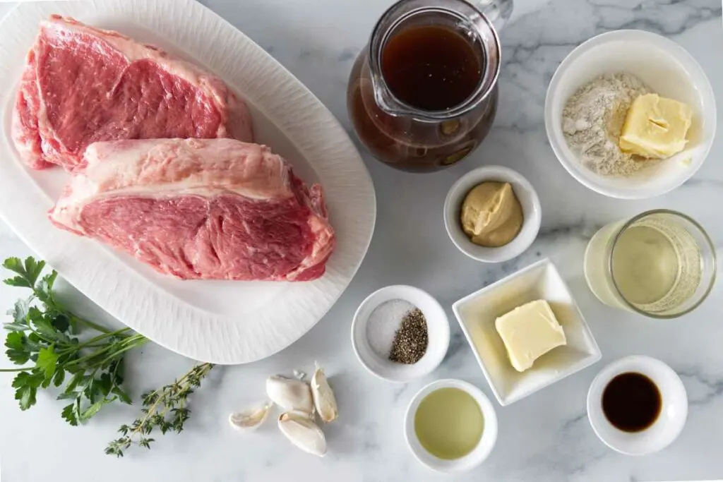 Ingredients to make garlic butter steak bites and the sauce.