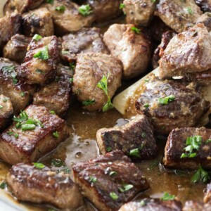 Garlic steak bites in a skillet.