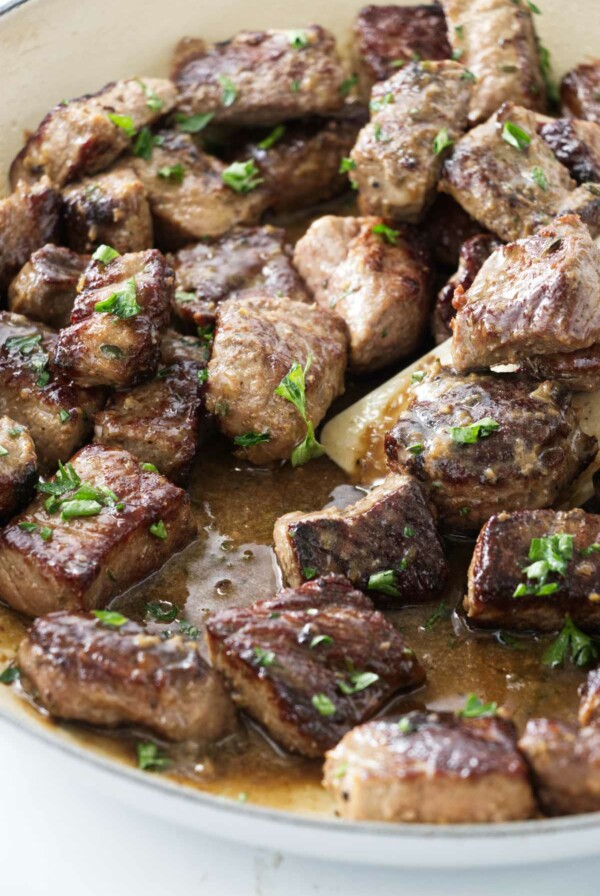 Garlic steak bites in a skillet.