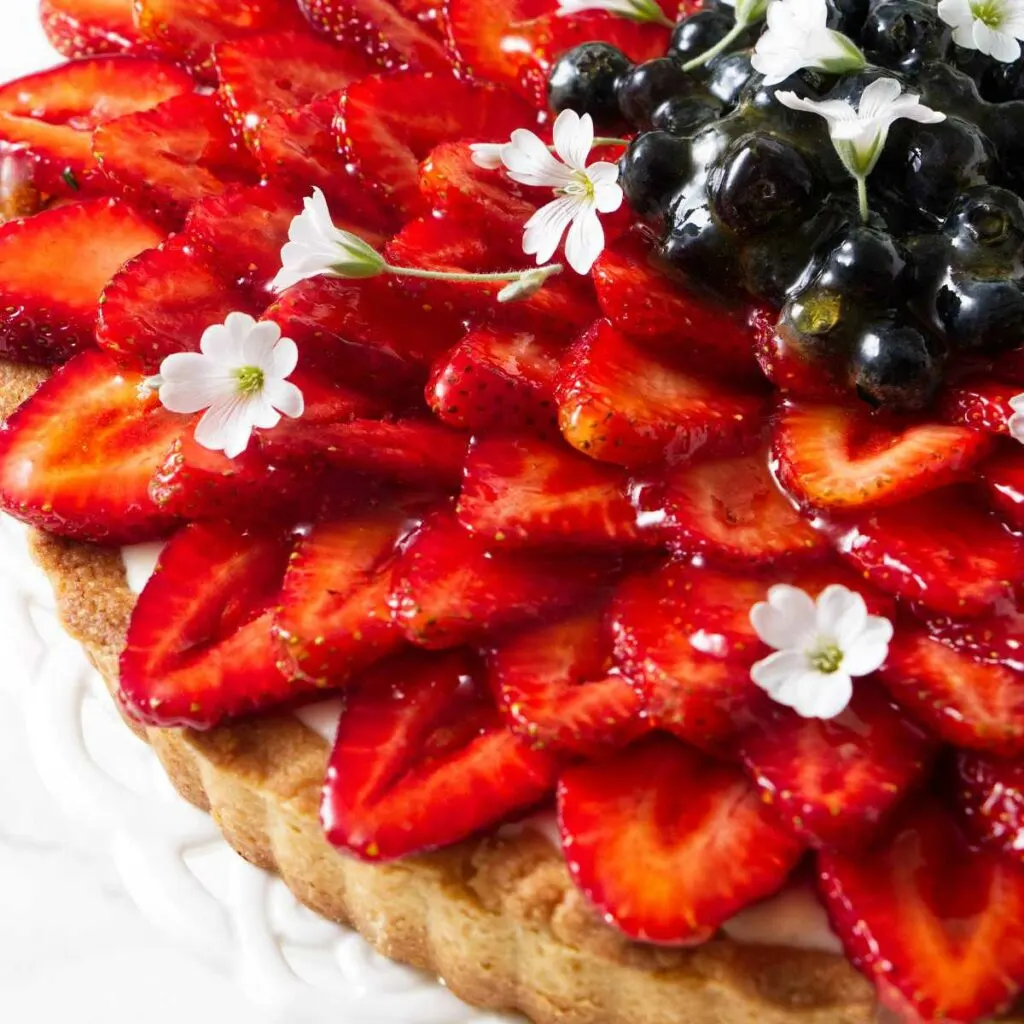 A tart topped with strawberries.
