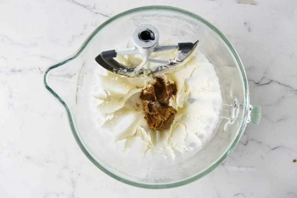 Beating biscoff cookie butter into buttercream.