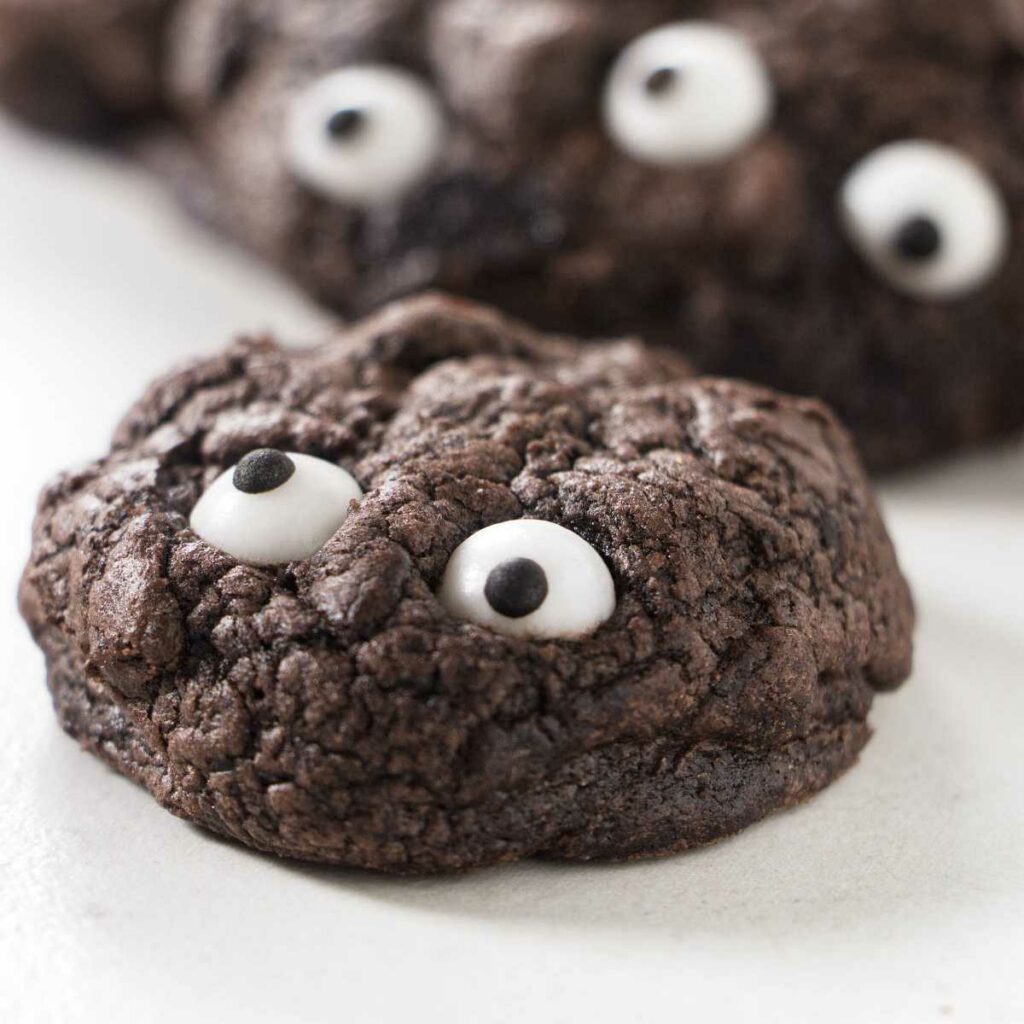 Black cookies with candy eyes.