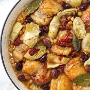 Pot with chicken, artichokes, olives and garbanzo beans ready to be served.