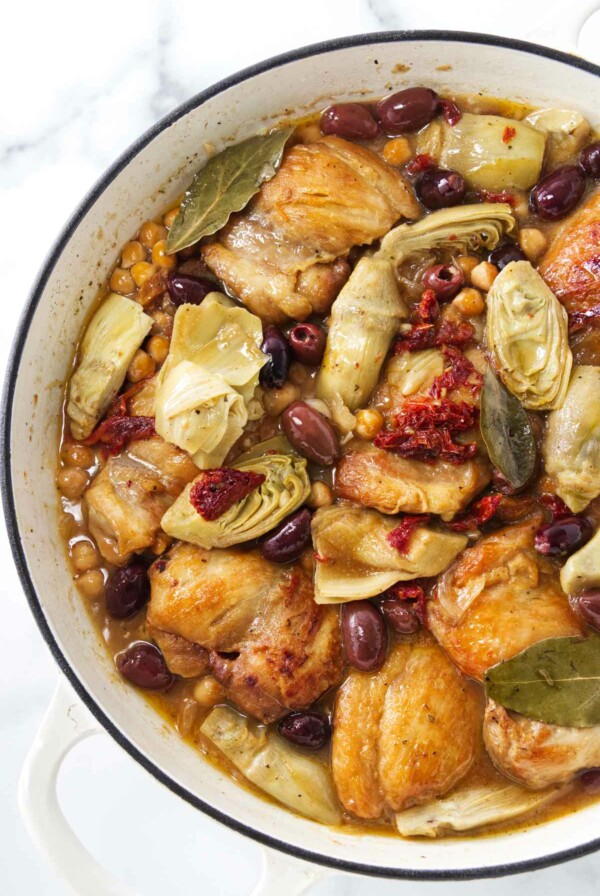 Pot with chicken, artichokes, olives and garbanzo beans ready to be served.