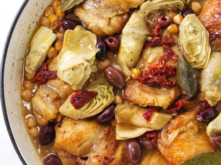 Pot with chicken, artichokes, olives and garbanzo beans ready to be served.