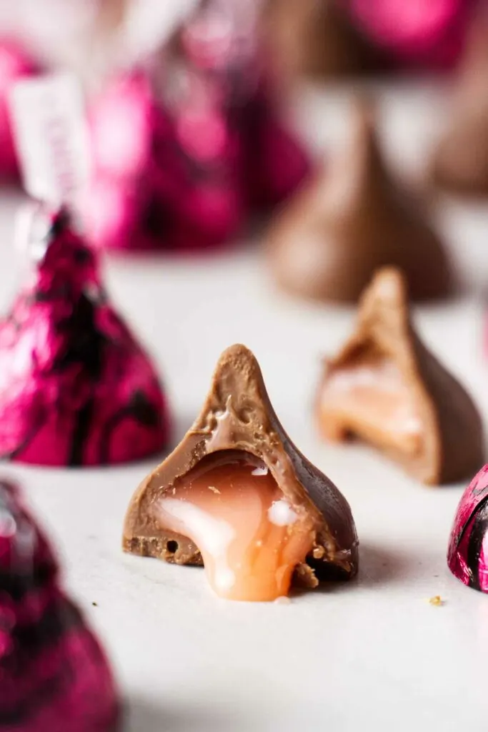 A cherry cordial Hershey's kiss with cherry sauce in the center of the candy.