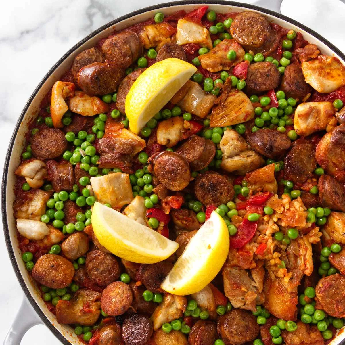 A large skillet filled with chicken chorizo paella.