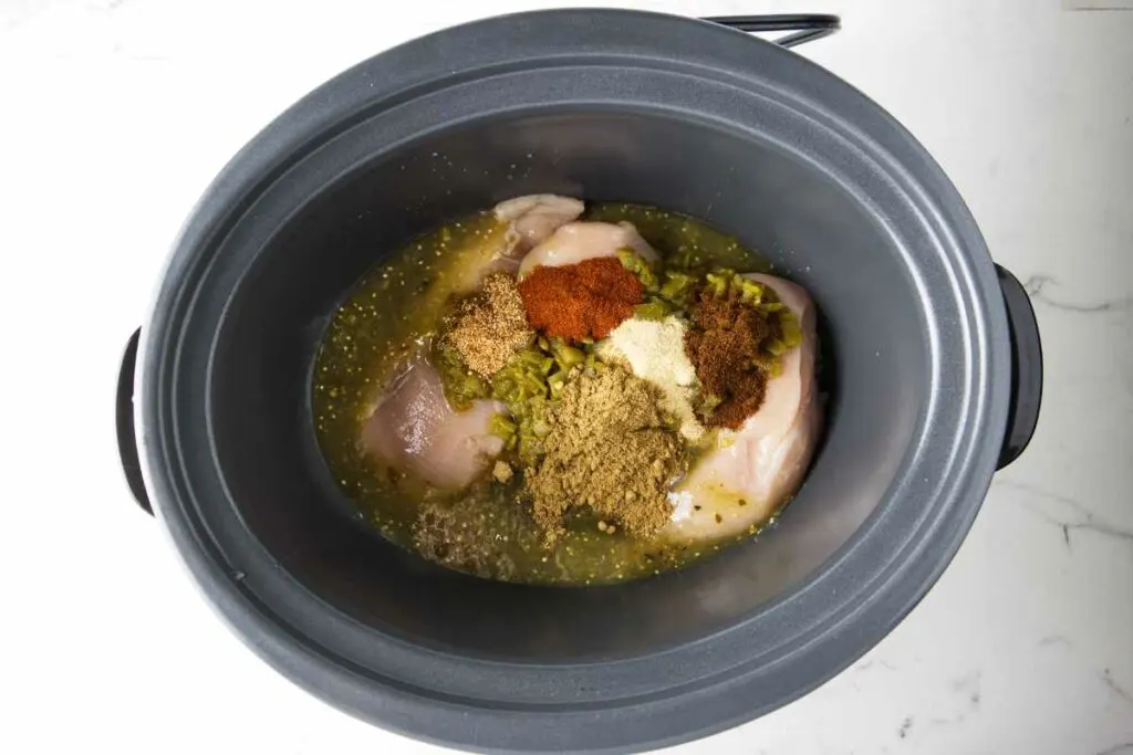 https://savorthebest.com/wp-content/uploads/2023/09/slow-cooker-green-chile-chicken_5139-1024x683.jpg.webp