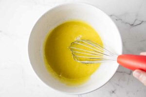 Whisking eggs with sugar.