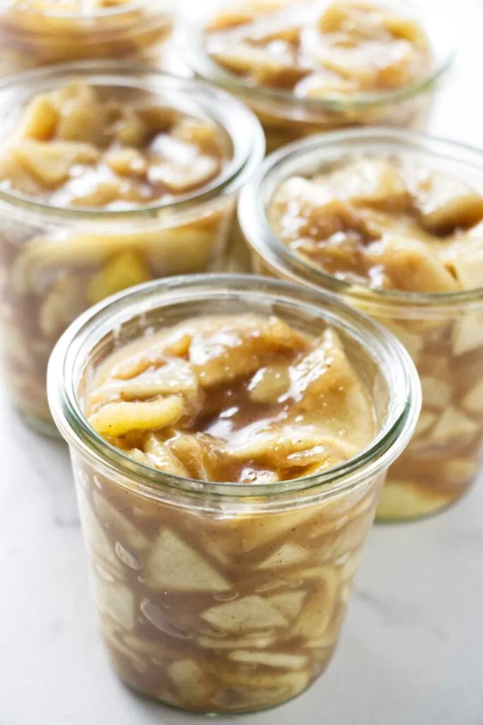 Homemade slow cooker apple pie filling in jars.