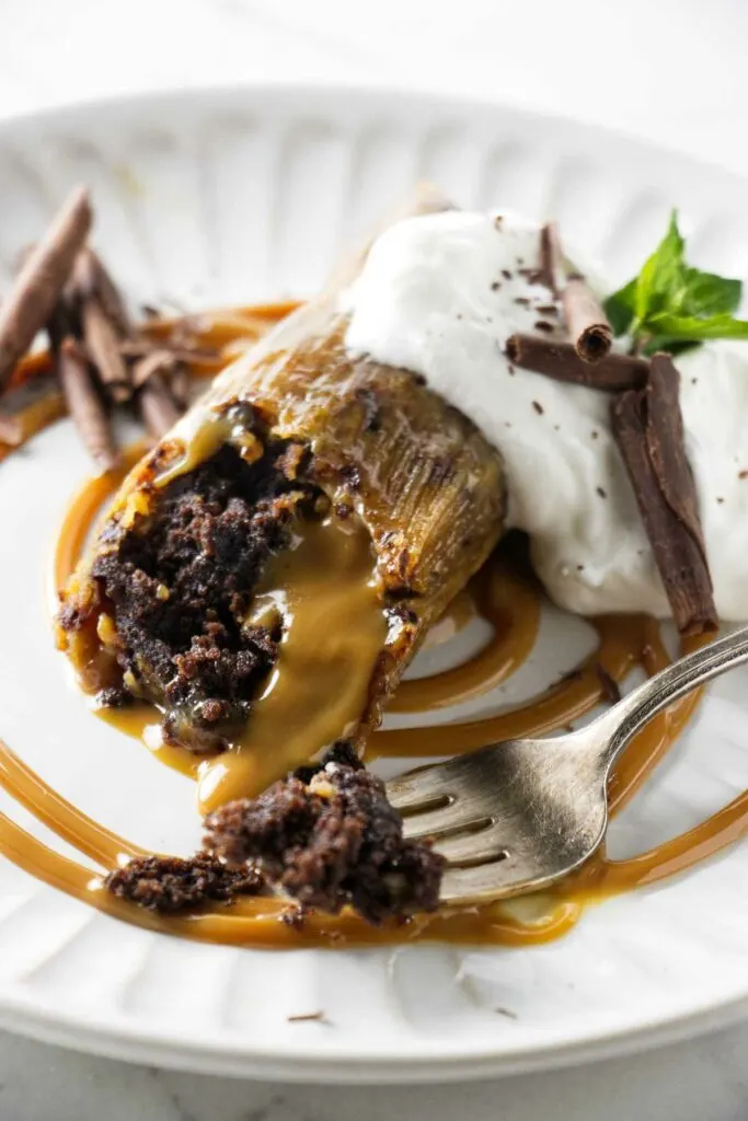 A dessert tamale stuffed with brownie and dulce de leche.