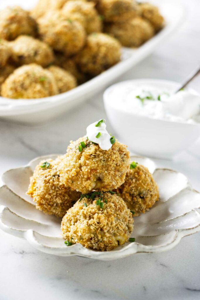 Potato croquettes baked in the oven and served with sour cream.