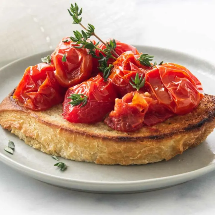 Confitted Tomato Bruschetta on a small plate.