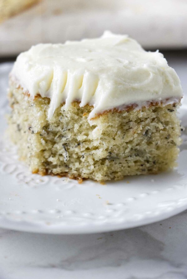 A slice of banana lemon cake with a bite taken out of the corner.