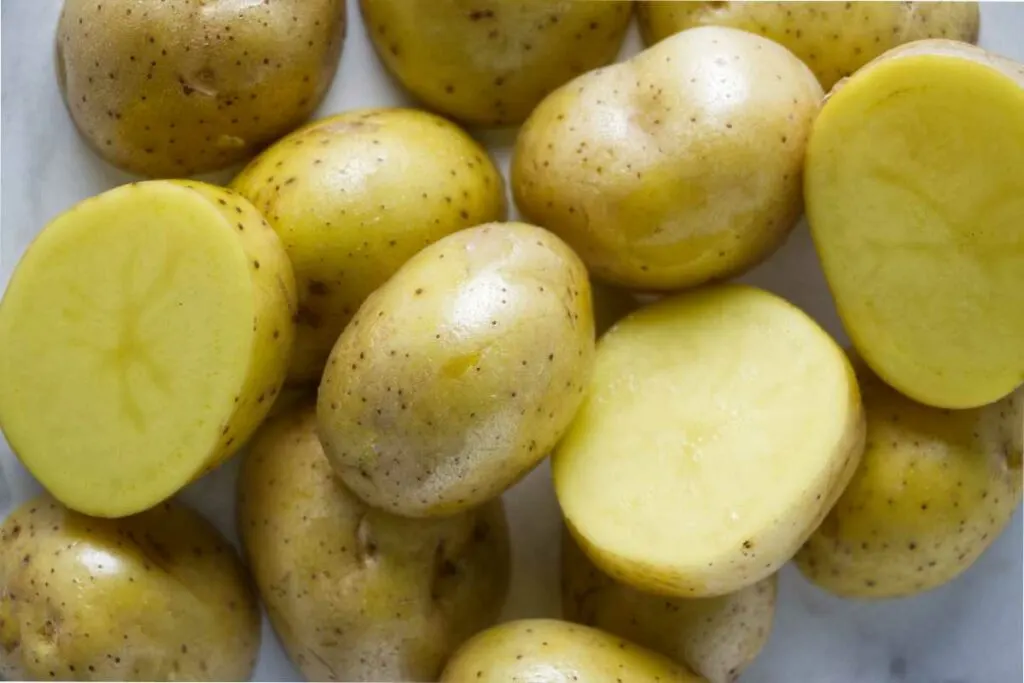 Yukon gold potatoes on a counter.